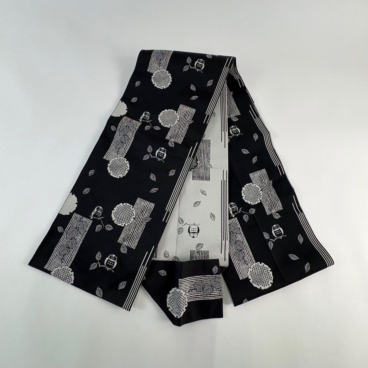 名古屋帯 名品 八寸名古屋帯 松葉仕立て ふくろう 雪輪 黒 正絹｜中古