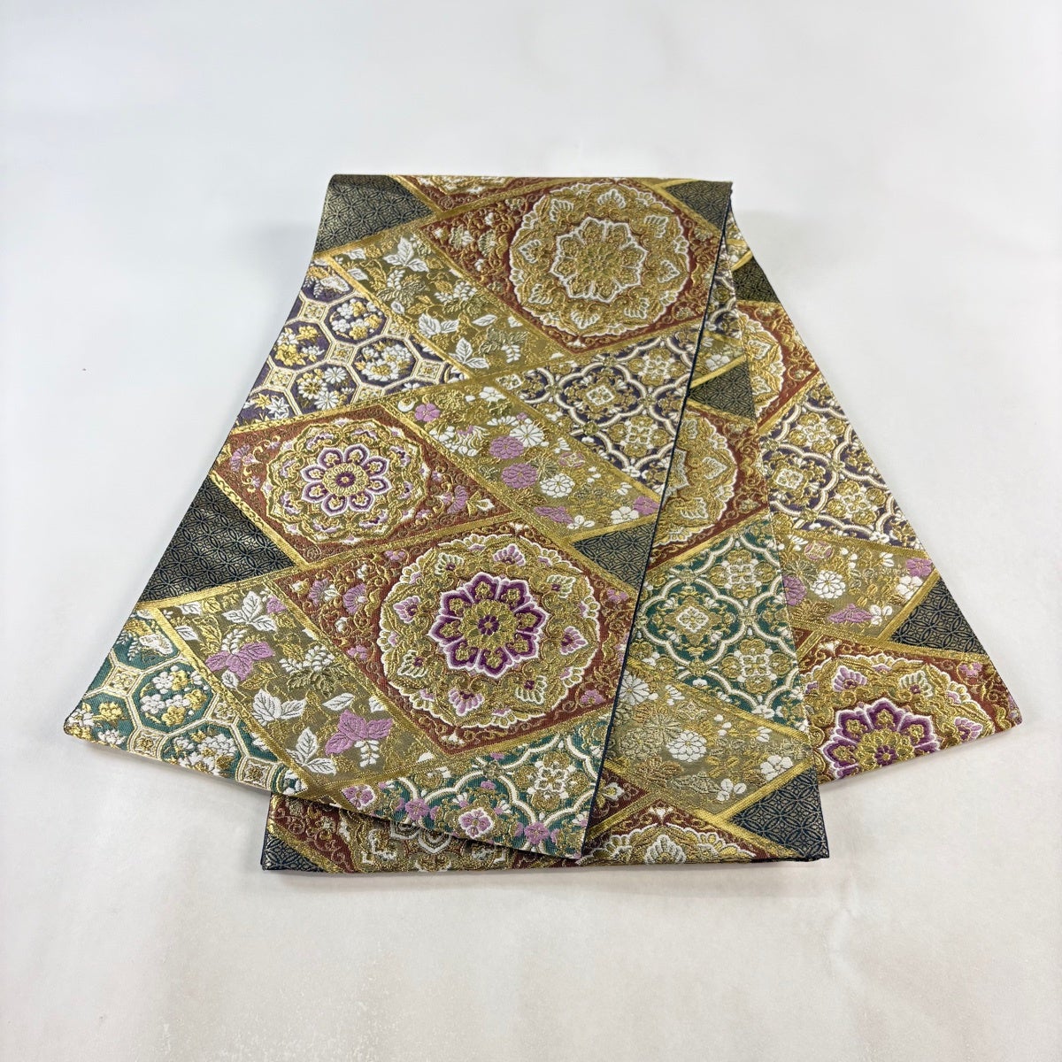 美品】 袋帯 逸品 じゅらく 落款あり 帝王紫 華文 花唐草 金糸 箔 赤茶