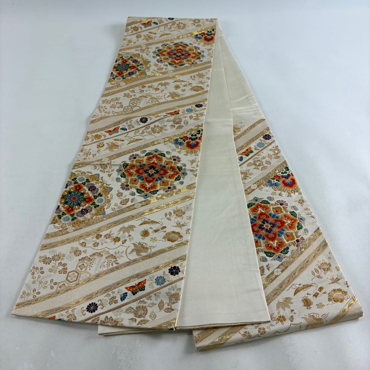 袋帯 秀品 華文 草花 金糸 箔 ベージュ 六通 正絹｜中古・古着