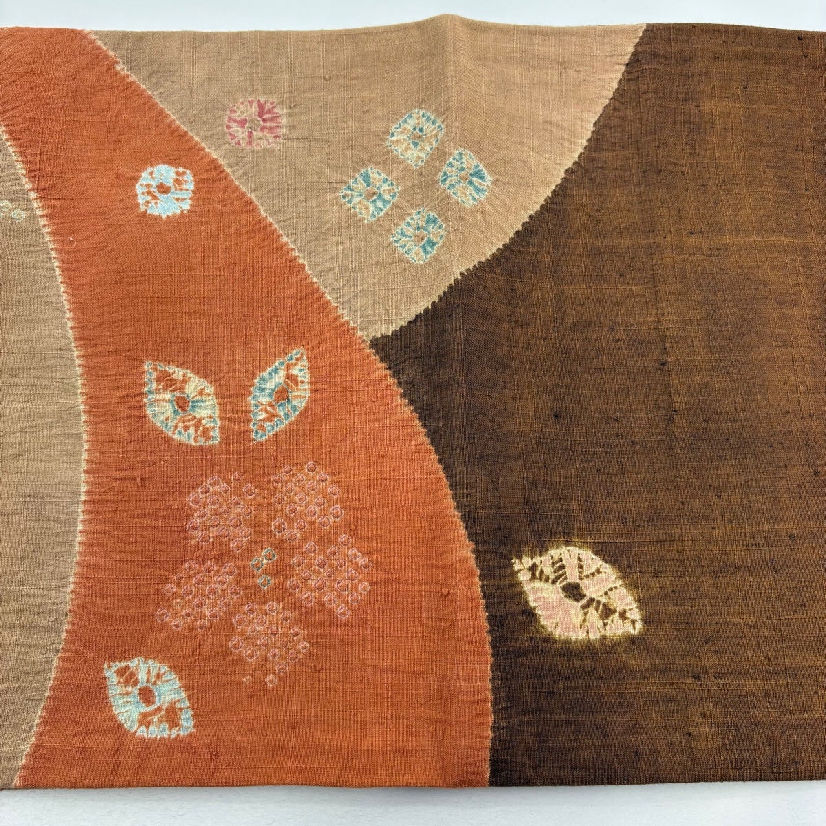 袋帯 秀品 紬地 草花 絞り オレンジ お太鼓柄 正絹｜中古・古着