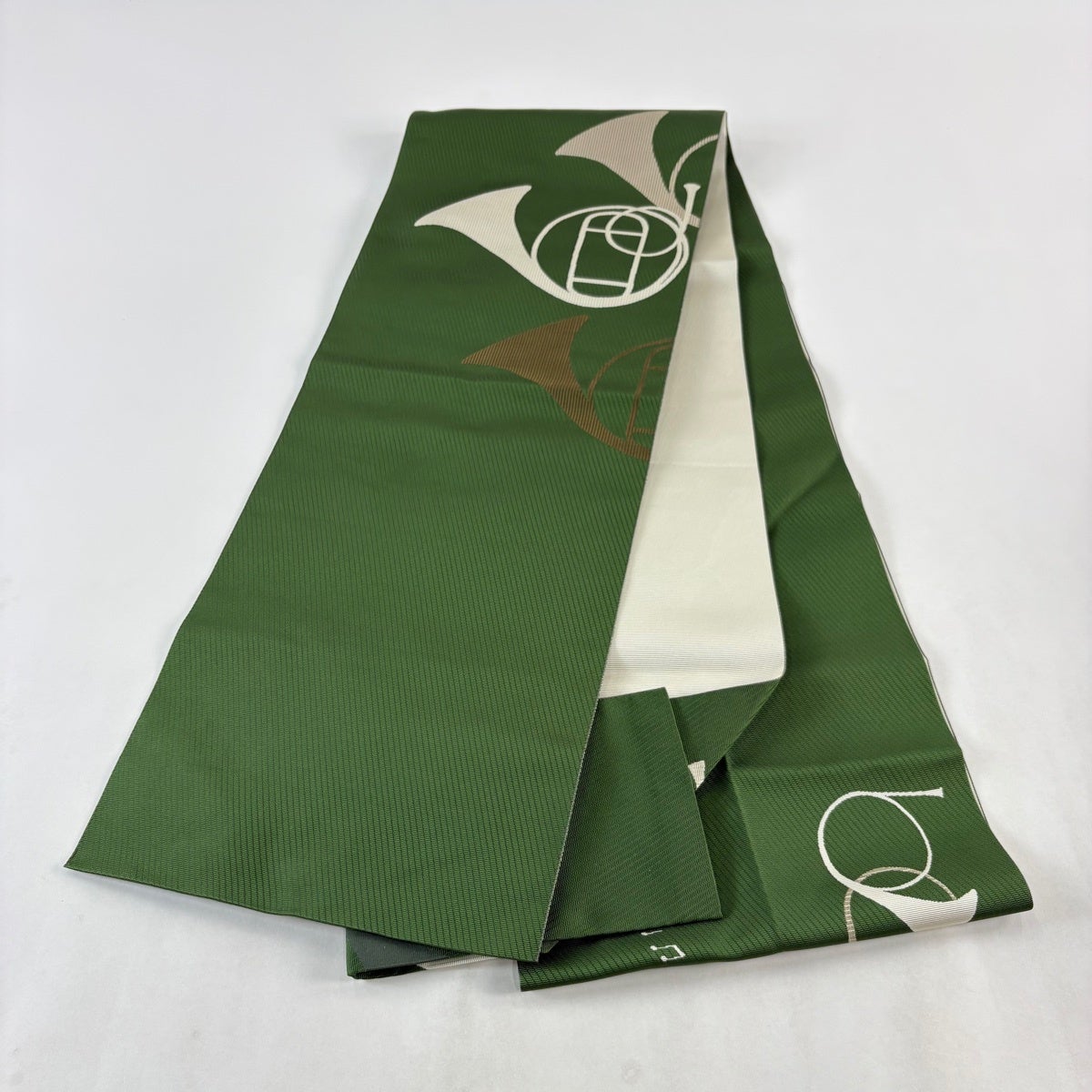 名古屋帯 逸品 八寸名古屋帯 松葉仕立て ホルン 音符 緑 正絹｜中古