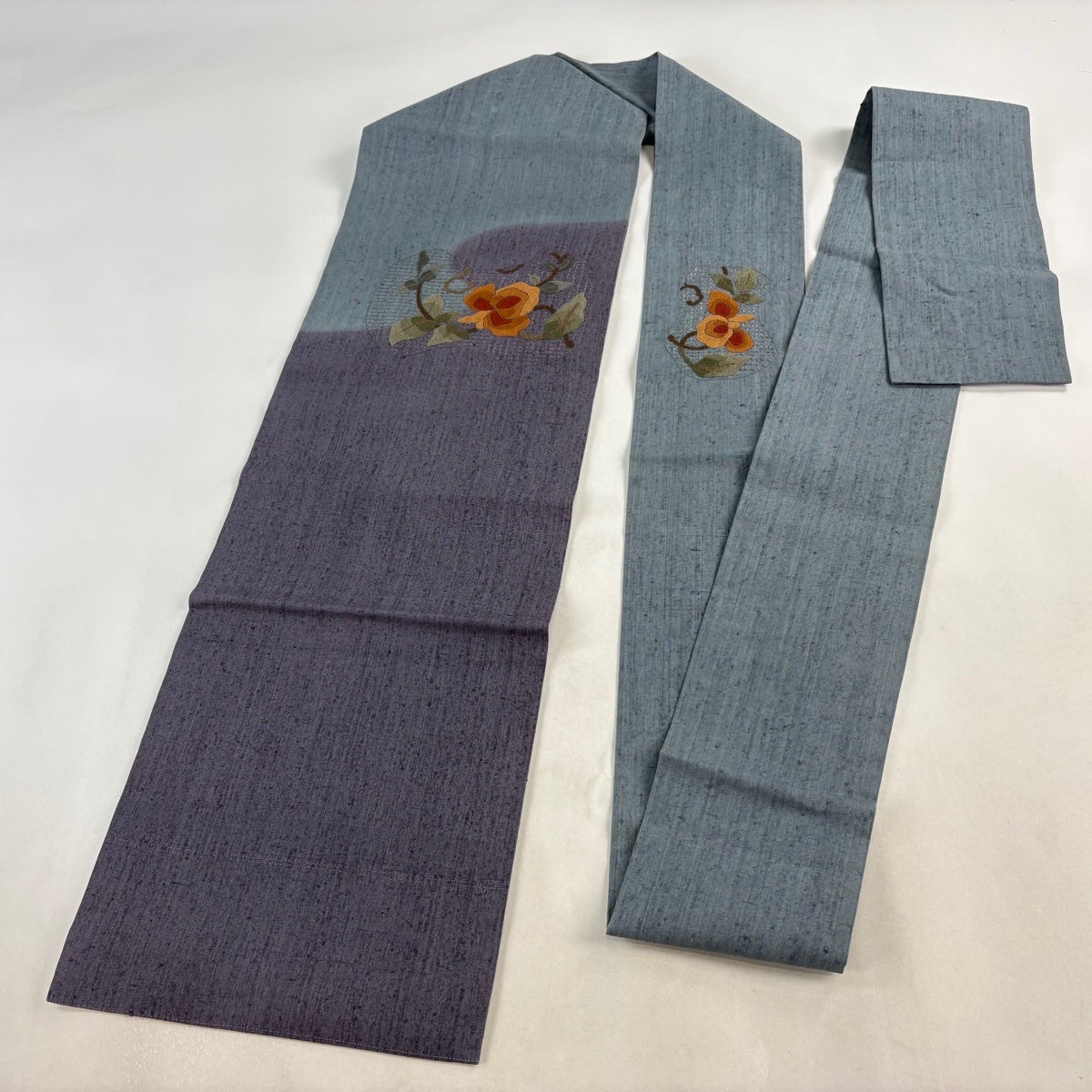 名古屋帯 秀品 紬地 関西仕立て 草花 相良刺繍 紫 正絹｜中古・古着