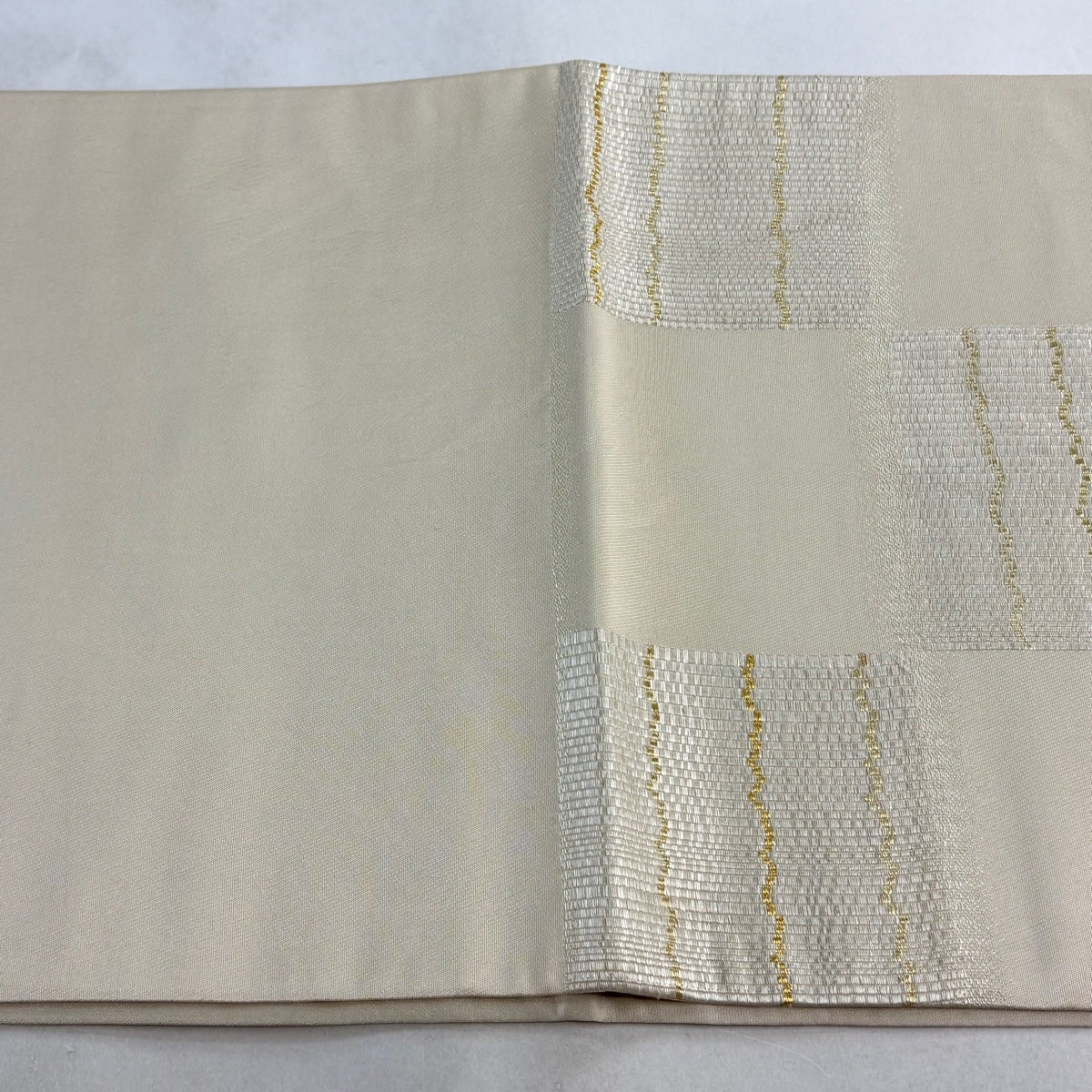 袋帯 逸品 祥園 落款あり 変わり市松 幾何学 金糸 箔 クリーム お太鼓