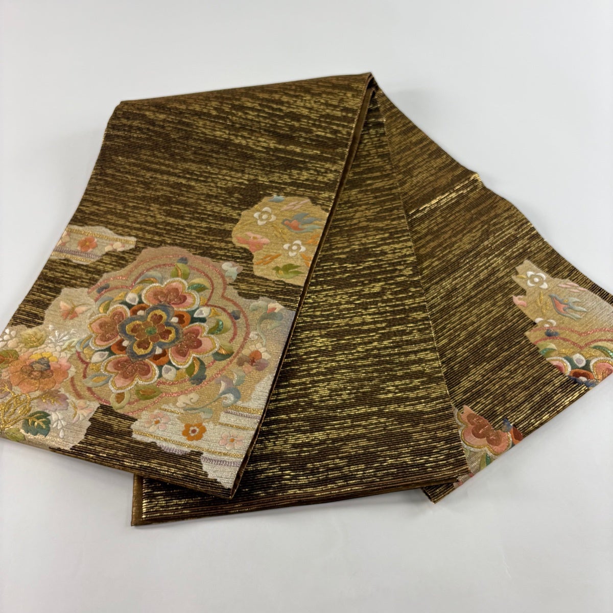 美品】 袋帯 秀品 華文 草花 金銀彩 箔 金茶 お太鼓柄 正絹｜中古