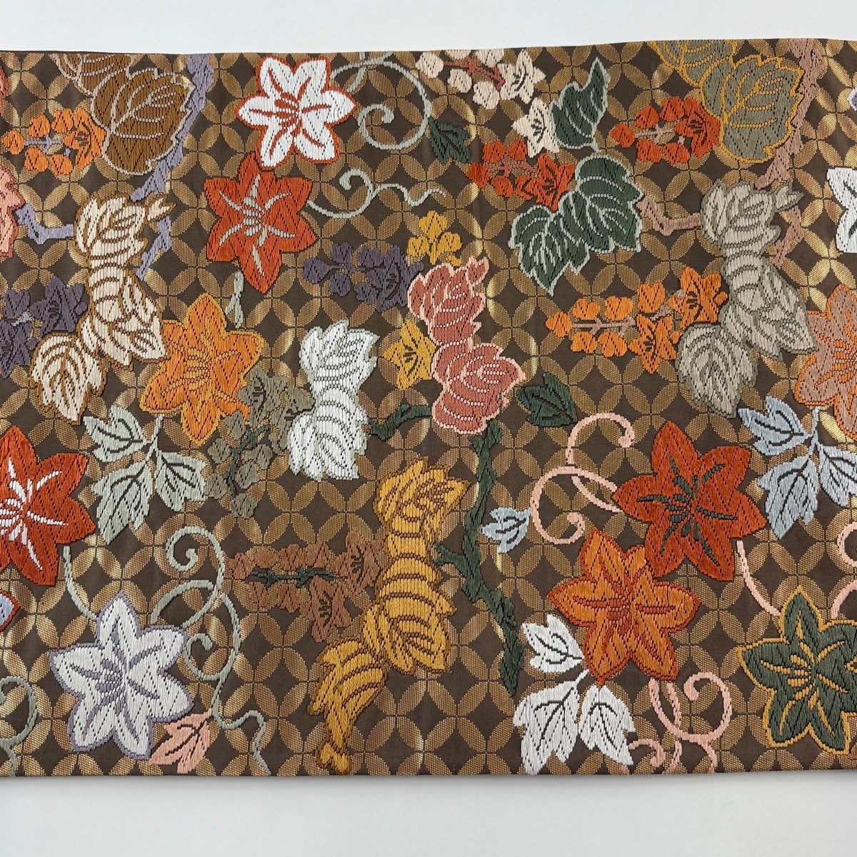 袋帯 秀品 七宝桐鉄線文 七宝 草花 唐織 箔 茶色 六通 正絹｜中古